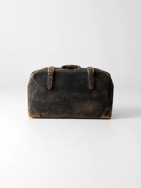 black leather suitcase circa 1930