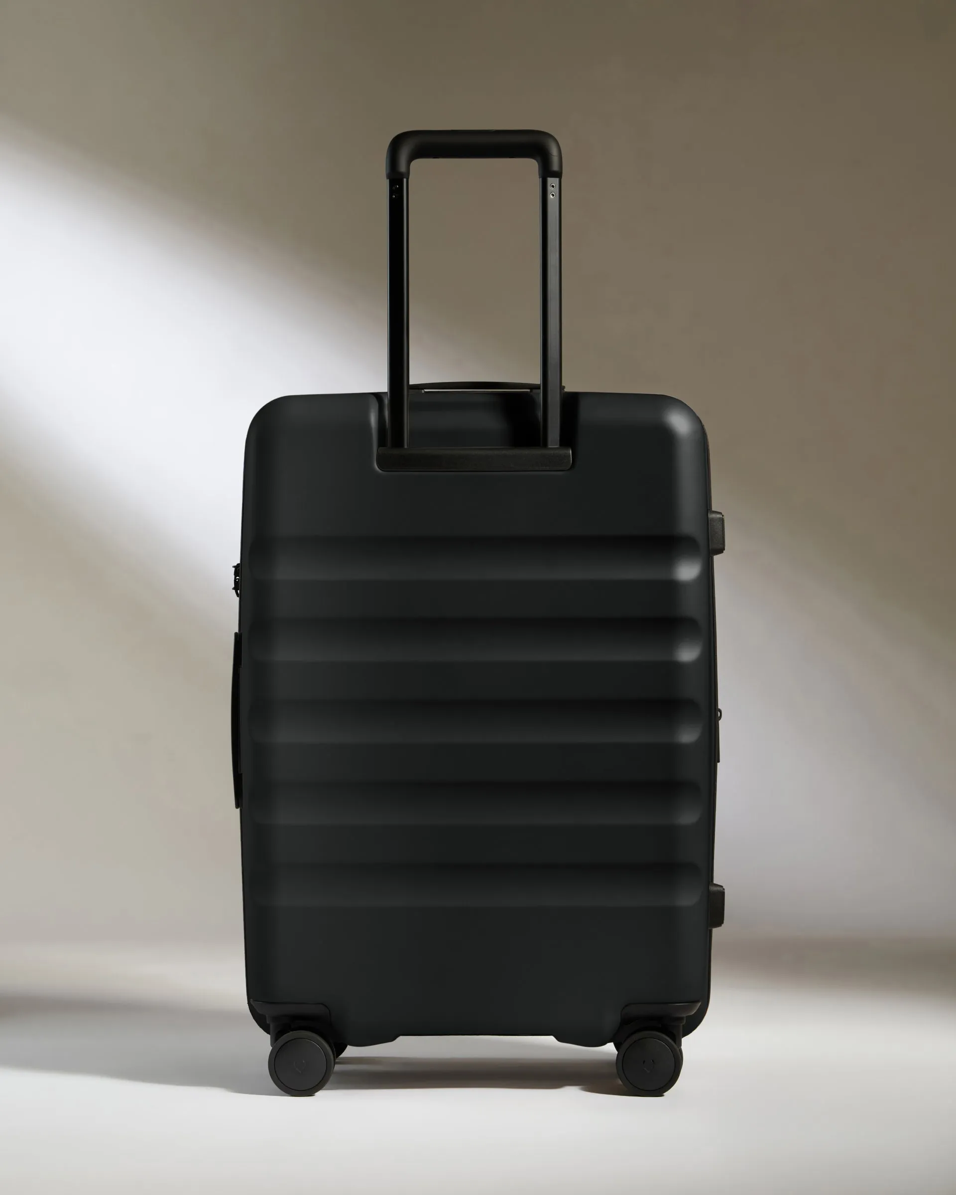 Medium Suitcase in Black - Icon Stripe